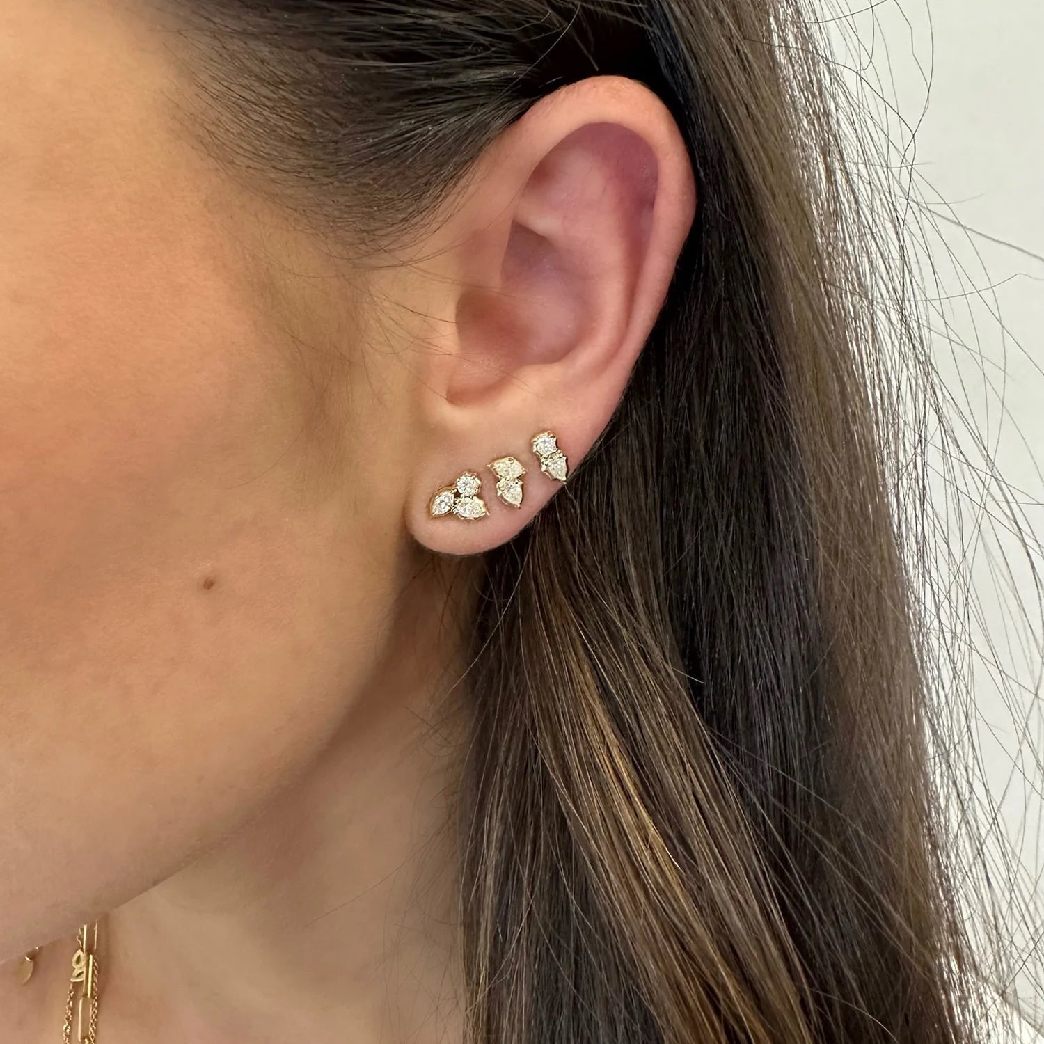 Three gold earrings deals