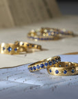 20K Wide Rounded Ring with 13 Star - Set Blue Sapphires - Peridot Fine Jewelry - Caroline Ellen