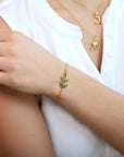 22K Flexible "Wheat" Charm Bracelet with Emeralds - Peridot Fine Jewelry - Cathy Waterman