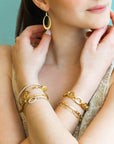 Caroline Ellen 18K Gold Oval Hinged Bangle with 18 Star-Set Diamonds