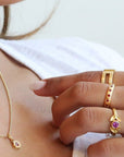 Caroline Ellen Gold "Laurel" Ring with Bezel-Set Pink Sapphire Center