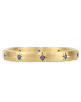 Caroline Ellen 20K Gold Narrow Slightly Rounded Ring with 10 Star-Set Blue Sapphires
