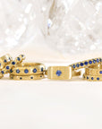20K Gold Narrow Slightly Rounded Ring with 10 Star-Set Blue Sapphires