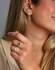 14K Infinity Plate Ring with Center Diamond Circled by Three Diamond Pave Halos - Peridot Fine Jewelry - Celine Daoust