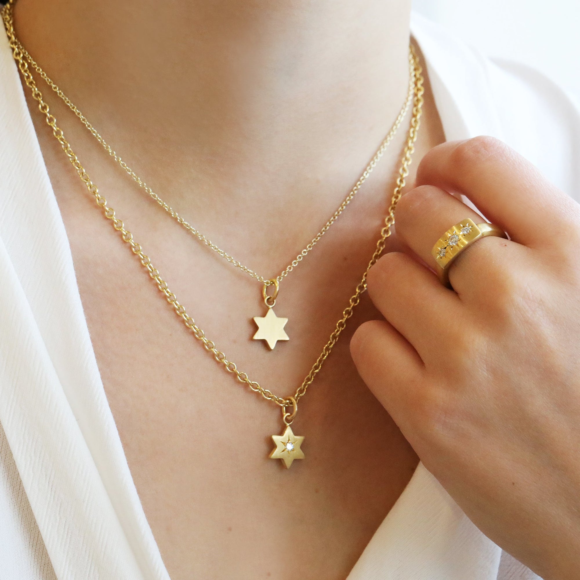20K Gold Six-Pointed Star Pendant with Star-Set Diamond Center