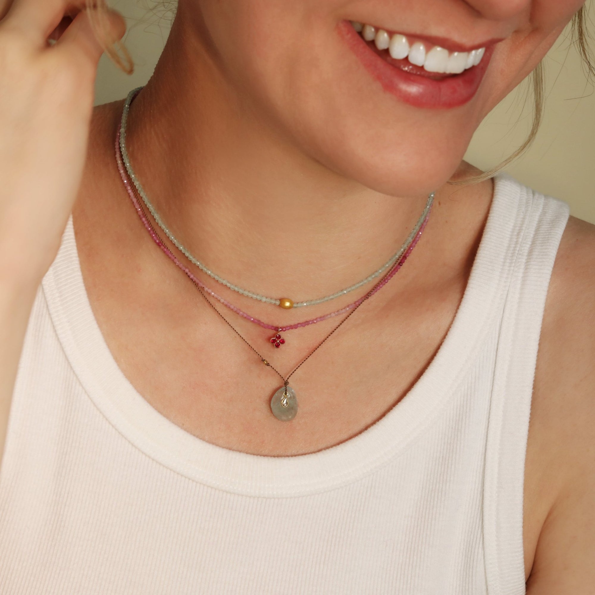 Faceted Oval Aquamarine Pendant Necklace with 18K Bezel - Set Teardrop Diamond Detail on Brown Cord - Peridot Fine Jewelry - Margaret Solow Jewelry