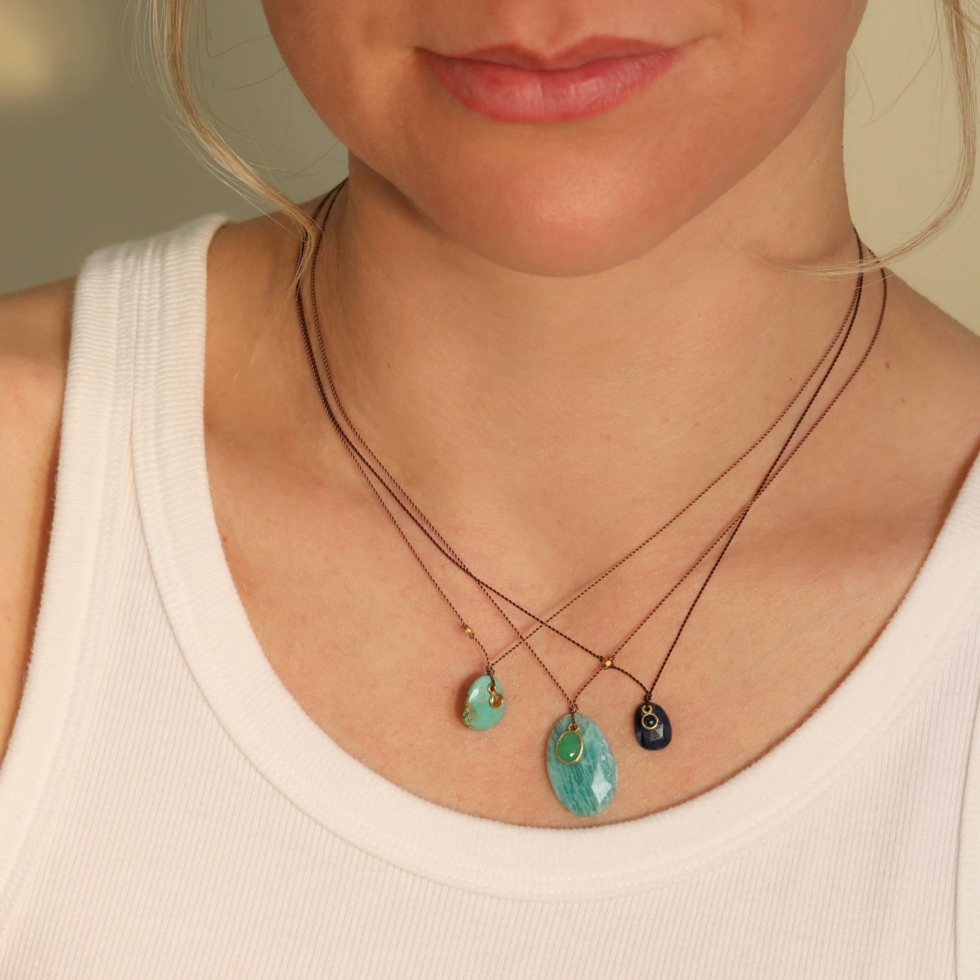 Faceted Oval Kyanite Pendant Necklace with 18K Bezel - Set Cabochon Blue Sapphire Detail on Brown Cord - Peridot Fine Jewelry - Margaret Solow Jewelry