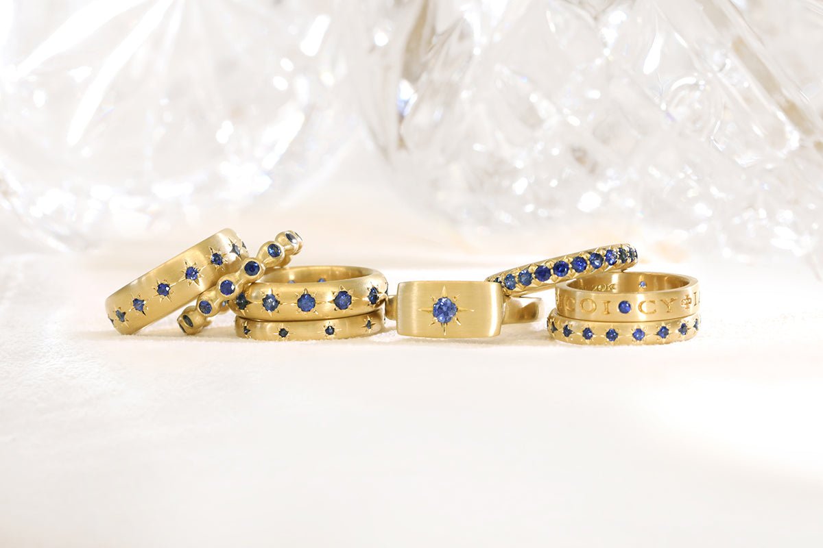 20K Gold Narrow Slightly Rounded Ring with 10 Star-Set Blue Sapphires